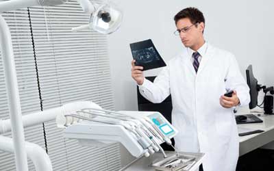 Doctor Looking at X - Ray