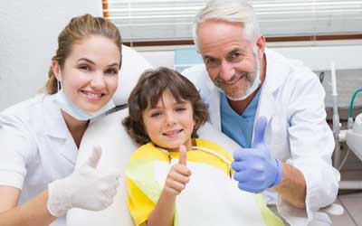 Kid Patient with Two Dentist