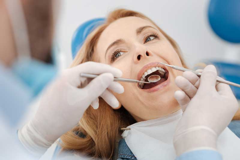 Dentist With Patient in Dental