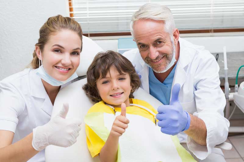 Two Dentists with Child Patient